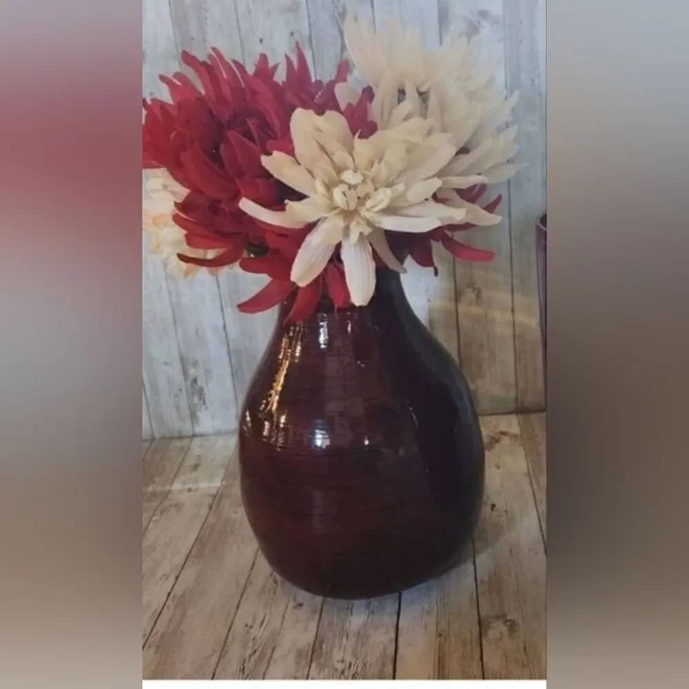 Large red decorative lacquerware vace and flowers